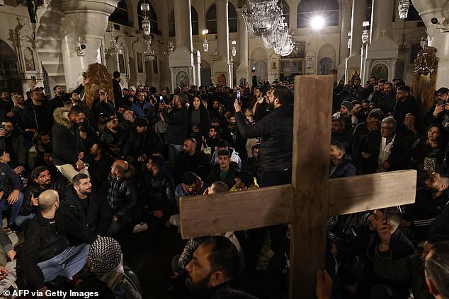 Hundreds of demonstrators took to the streets in Christian neighborhoods of Damascus early on December 24