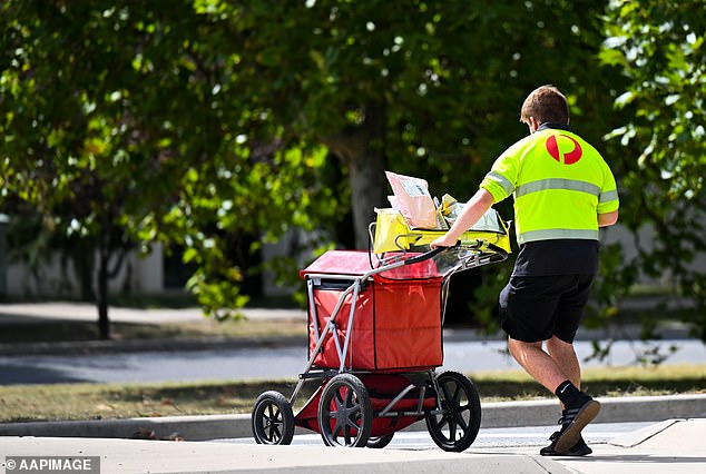 An Australia Post spokeswoman told Daily Mail Australia that the majority of parcels and parcels they process are delivered safely to their intended recipient (pictured an Australia Post employee delivering parcels)