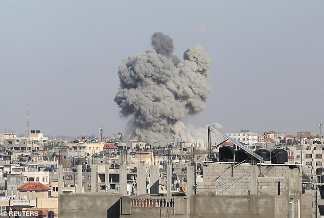 The harrowing war in the Middle East between Israel and Hamas also continues despite mediators' efforts to broker a ceasefire (photo rises from a building in southern Gaza