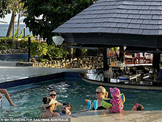 Five of the victims have now been discharged, including a mother and daughter from Sydney who returned home on Monday evening (Photo: Tourists were seen enjoying a drink at the pool bar on Monday)