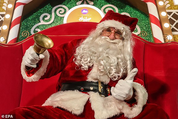 epa11791279 A man dressed as Santa Claus dances during a pre-Christmas carnival in Mumbai, India, December 23, 2024. Christmas Day is a Christian holiday celebrated on December 25 to commemorate the birth of Jesus. EPA/DIVYAKANT SOLANKI