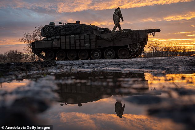 Ukrainian soldiers from the 33rd Brigade pilot a Leopard battle tank towards Kurahove, Ukraine as the war between Russia and Ukraine continues on December 19, 2024