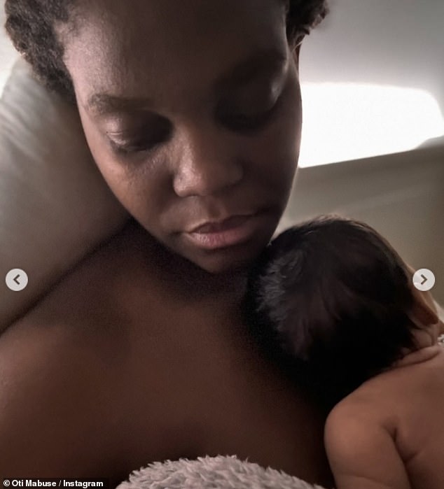 In one fell swoop, Oti had her eyes closed as her daughter rested on her chest