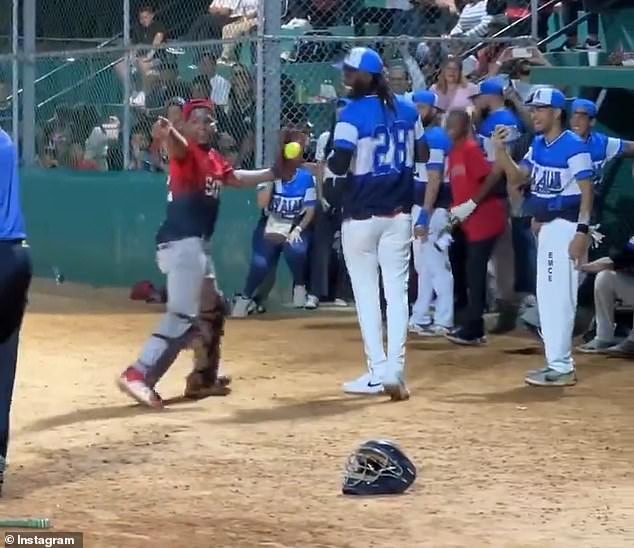 Elly De La Cruz struggled to contain his laughter after striking out in his first at-bat at the softball game on Saturday