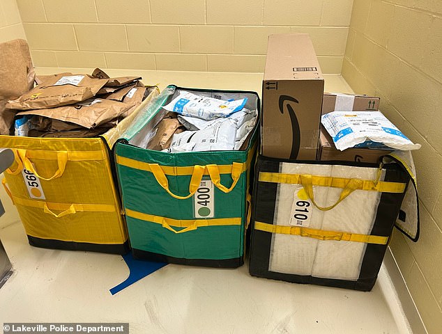 In the photo: all 80 packages are at the police station after being collected by officers. They were later delivered to a nearby Amazon distribution center