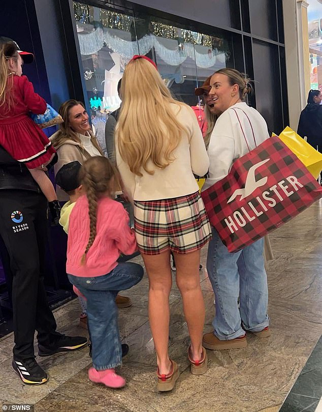 Molly-Mae, Tyson, 36, and Paris, 35, appeared to cross paths at the Trafford Center in Greater Manchester on Monday, along with Molly-Mae's sister Zoe (right)