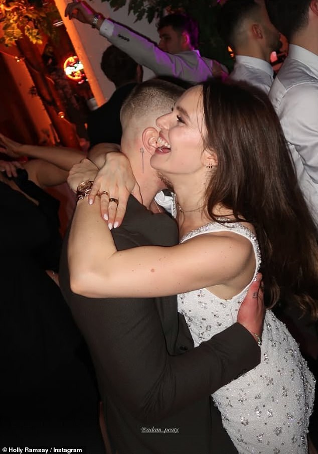 Holly looked smitten with her fiancé Adam Peaty as they danced the night away for their engagement party on Monday