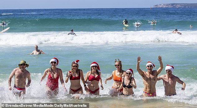 1735093532 91 Red hot Christmas Thousands of bikini clad revellers embrace the festive