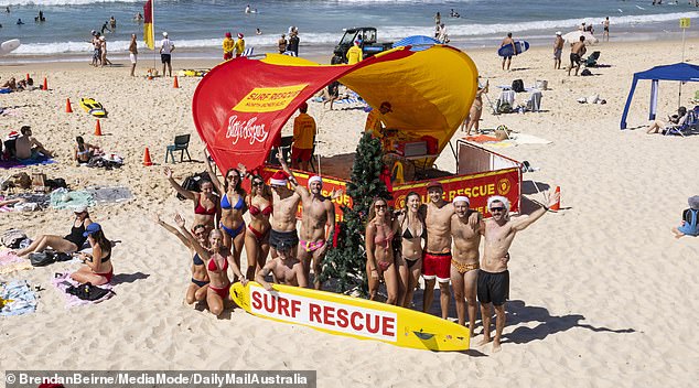 Beachgoers posed under the rescue tent in North Bondi