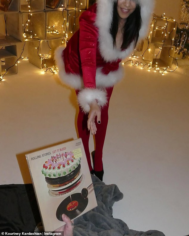 Travis was seen presenting Kourtney with a copy of The Rolling Stones' iconic 1969 LP Let It Bleed