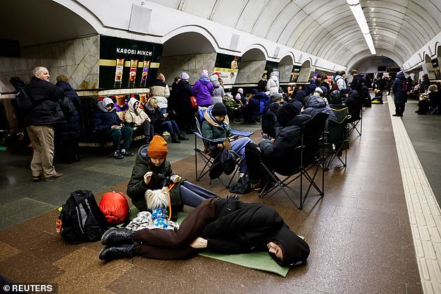 People take shelter in a metro station during an airstrike, amid the Russian attack on Ukraine, in Kiev, Ukraine, December 25, 2024