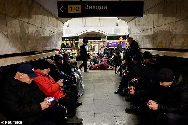 People take shelter in a metro station during an airstrike, amid the Russian attack on Ukraine, in Kiev, Ukraine, December 25, 2024