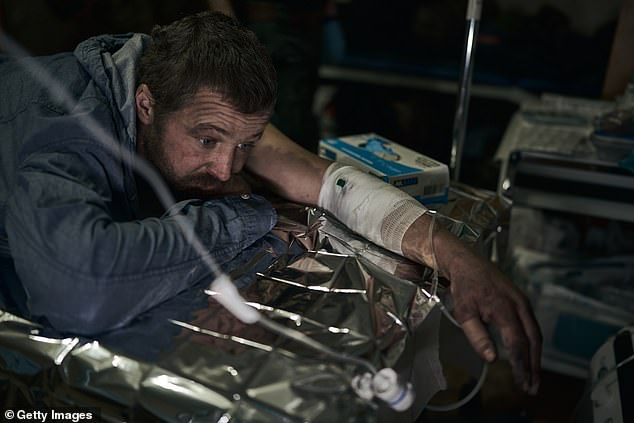 A patient receives first aid at a stabilization point on December 24, 2024 in Kupiansk, Ukraine