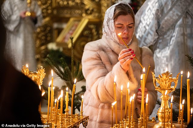 Residents of Kiev attend Christmas service at St. Michael's Monastery in Kiev, Ukraine on December 24, 2024