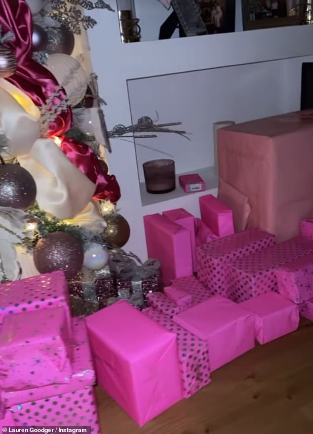 Each of the gifts were neatly wrapped in bright pink and silver wrapping paper and placed on her white Christmas tree