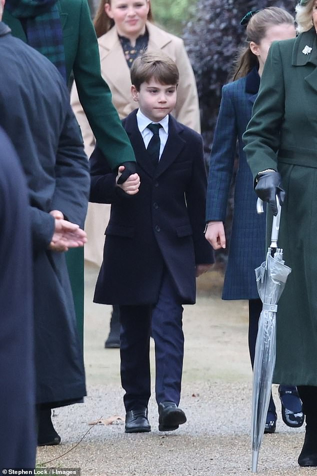 Prince Louis appeared serious as he walked next to his family