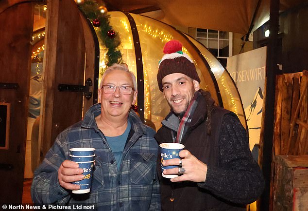 A man in Newcastle wears a Christmas pudding hat as he takes part in the festive fun