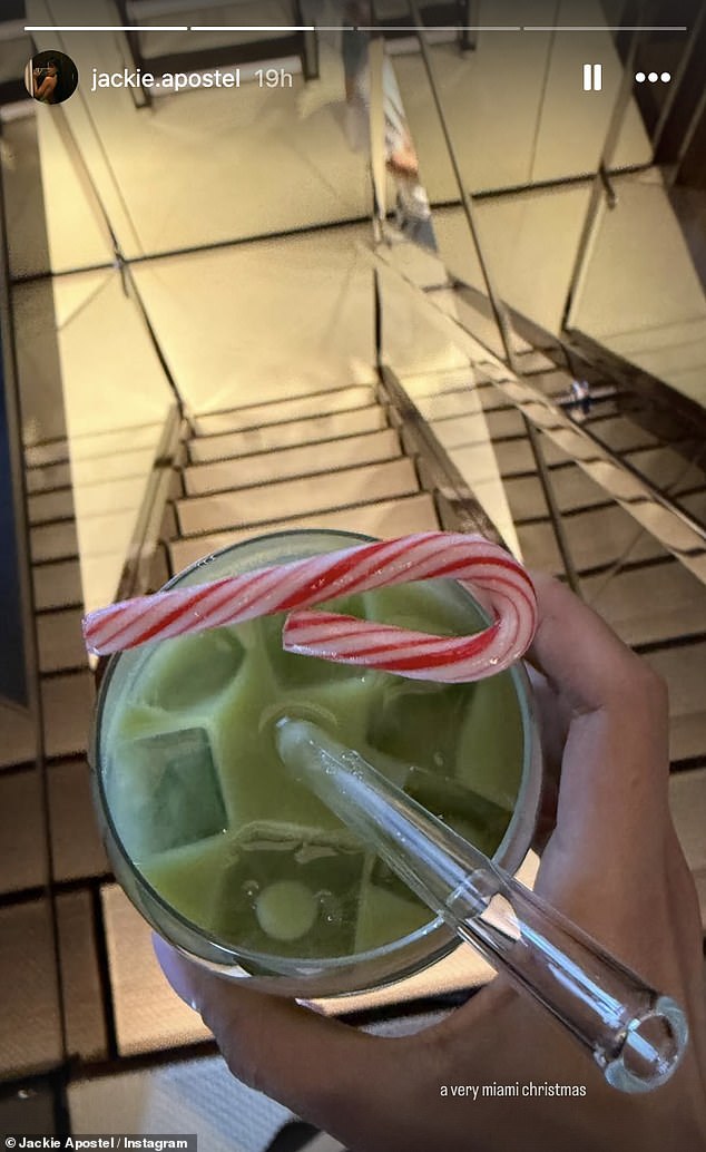 She gave a little glimpse into the day, snapping a photo of her Christmas-themed cocktail, complete with a candy cane, with the caption: 