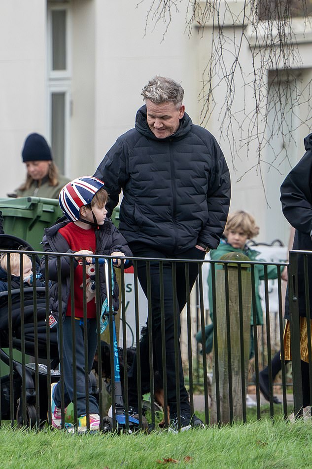 He stopped for a chat with his second-youngest son Oscar James, who donned a cute red Christmas sweater and made his way around on a scooter.