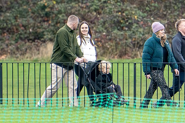 Holly and her fiancé Adam Peaty looked as loved up as ever as they stayed together during the outing as the Olympian pushed his son George in a stroller