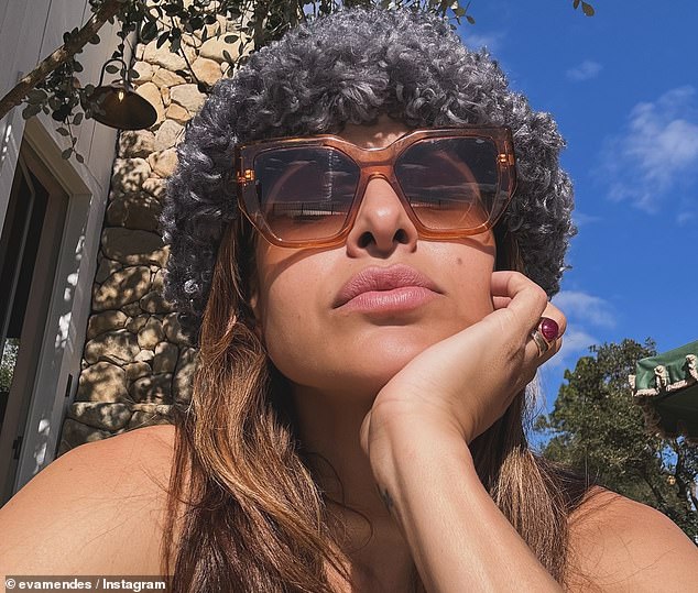 Eva Mendes, who has been with Ryan Gosling for 13 years, enjoyed 'A very Cali Xmas' as she sunbathed outside