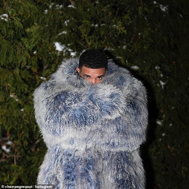 Drake dressed up in an extravagant blue and white possibly faux fur coat and boasted: 