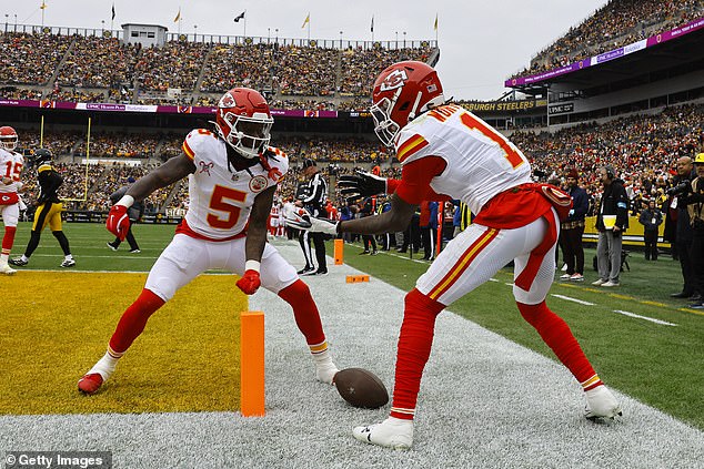 Xavier Worthy (1) celebrates his touchdown with Hollywood Brown (5) with a pantomime