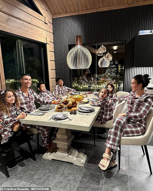 Cristiano Ronaldo pictured with his girlfriend Georgina Rodriguez, 30, and his children Cristiano Ronaldo Jr, 14, Alana Martina, eight, twins Eva Maria and Mateo, seven, and Bella, two