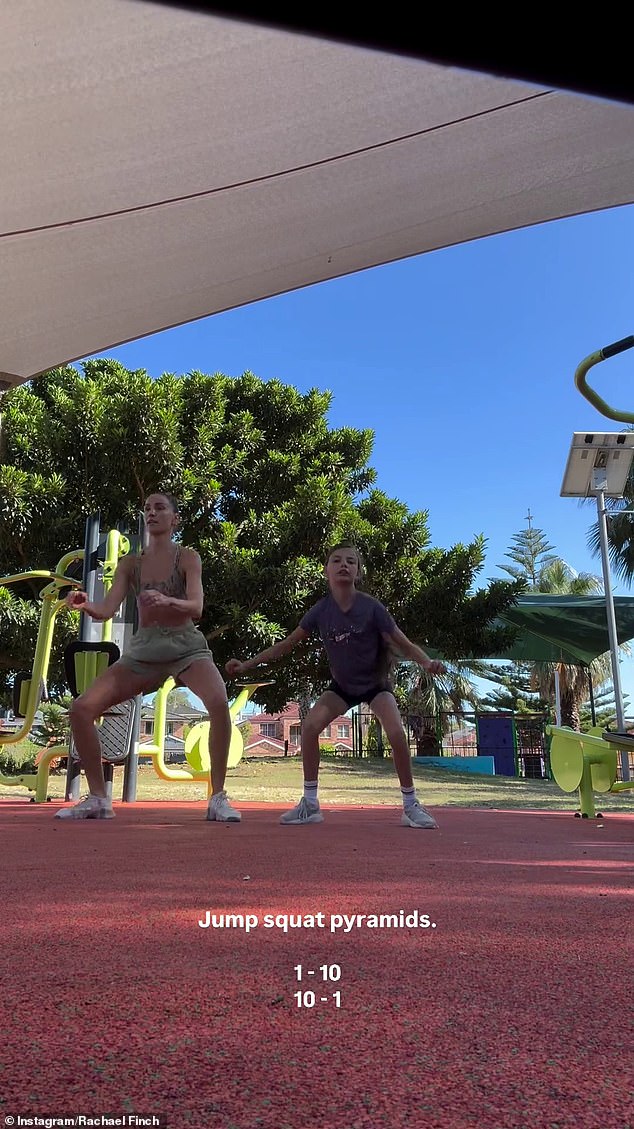 She looked the business as she led Michael, Violet and Dominic through a series of pyramid jump squats