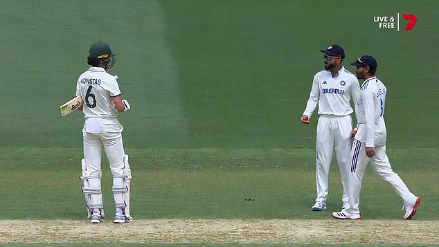 Konstas (left) exchanged angry words with Kohli (second from right) after the collision.