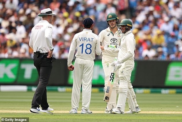 The teenager's batting partner, Usman Khawaja (right) had to come between the rivals to calm the situation - before Konstas returned to crushing the Indian attack