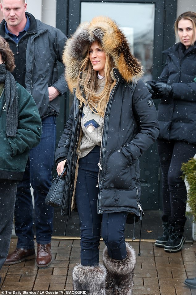 She tucked the sweater into black, skin-tight leggings and her pants into fuzzy, fur-covered boots.