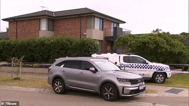 Police and paramedics rushed to the scene after reportedly receiving a call from the woman's husband, aged 63, who also lived in the house. He has now been charged with murder (photo: the building is cordoned off with police tape)