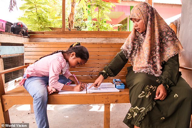 Khairani is pictured in 2014 with her daughter Alifa, who was about seven years old at the time of this photo