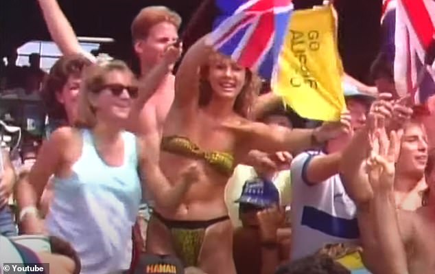 The late summer sun beat down on the players as the camera panned to the crowd, capturing a woman in a barely-there leopard print bikini, bravely waving a sign that read 'Go Aussies Go' amid a sea of ​​Union Jack-waving Poms (the woman, Tony's roommate at the time, is in the photo)