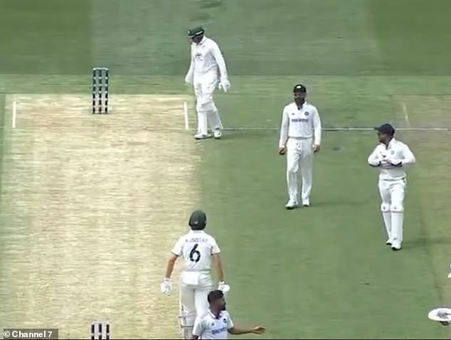 Kohli (second from right) was seen walking towards Konstas before the shoulder charge took place