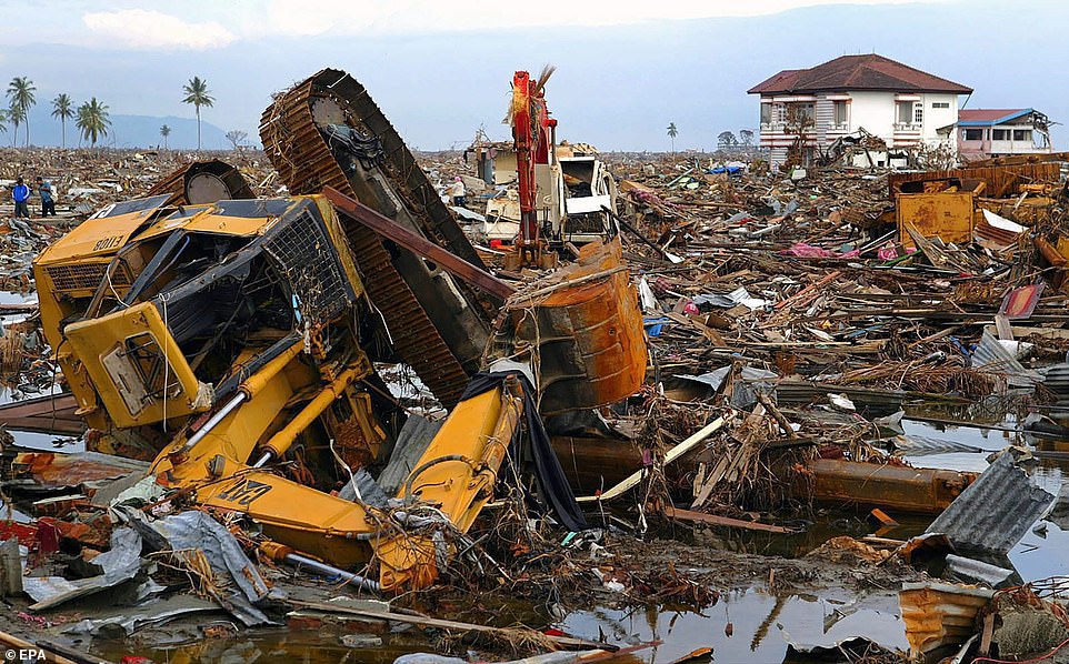 The wreckage of an excavator amid rubble in Banda Aceh, Indonesia, on January 10, 2005