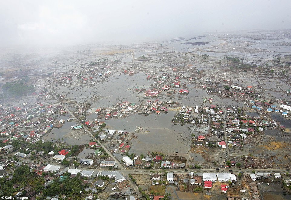 An aerial view taken from a US Navy Seahawk helicopter from aircraft carrier USS Abraham Lincoln shows the devastation caused by the Indian Ocean tsunami west of Aceh on January 8, 2005 in Banda Aceh, Indonesia