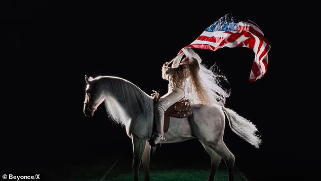 In it, the 43-year-old pop diva was in full Cowboy Carter mode: sitting on a white horse, wearing all-white western clothing and waving a large American flag.