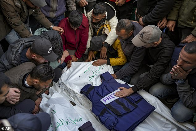 Relatives and friends mourn the bodies of five Palestinian journalists killed in an Israeli airstrike in Gaza City at Al-Aqsa Hospital in Deir al-Balah, Thursday, December 26, 2024