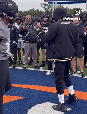 Travis Hunter (left) was praised by coach Deion Sanders (right)