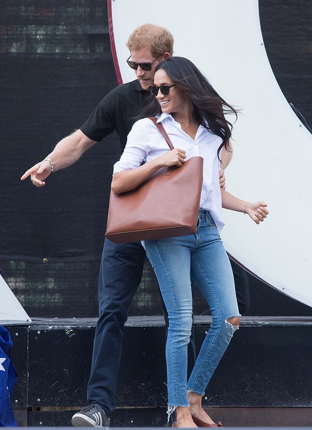 Harry accompanies Meghan during their first official appearance together, wearing ripped jeans and sunglasses