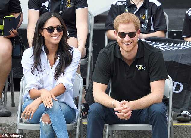 Meghan and Harry smiling during their first engagement together