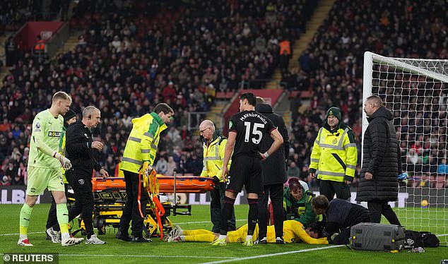 Aaron Ramsdale (left) rushed to the scene to check in on his other number during the delay