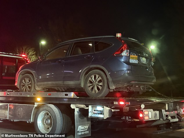 The Honda CRV involved in the near-fatal car crash is pictured on the truck bed