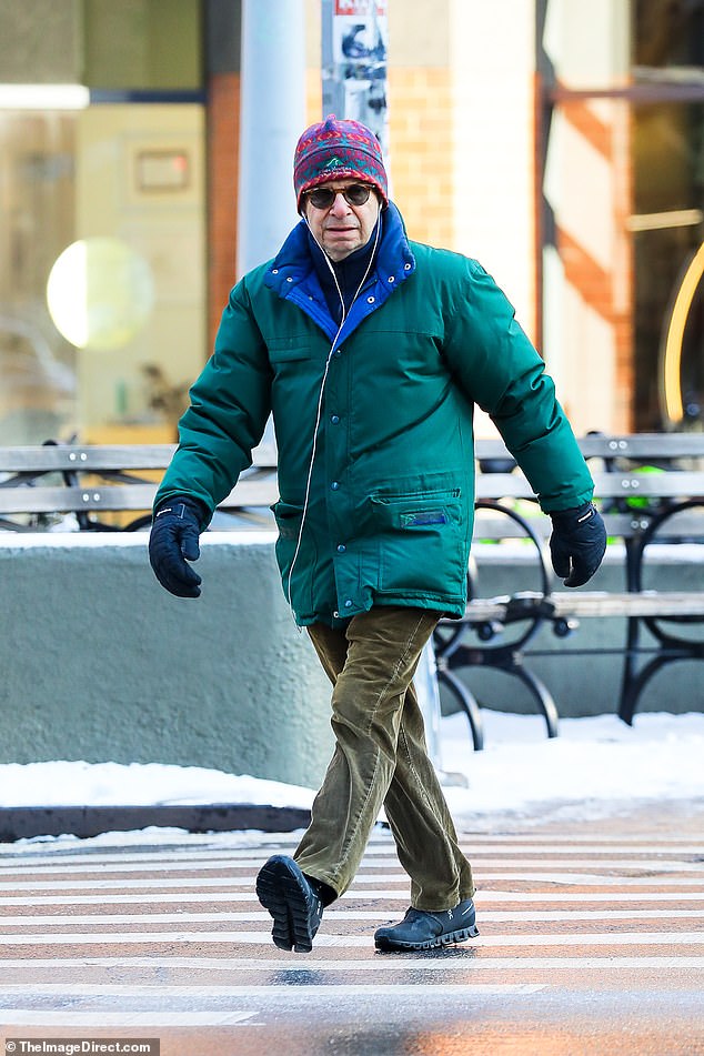 He wore an insulated jade green jacket over olive green trousers and black boots, as the outing comes almost 30 years after he retired from acting in 1997.