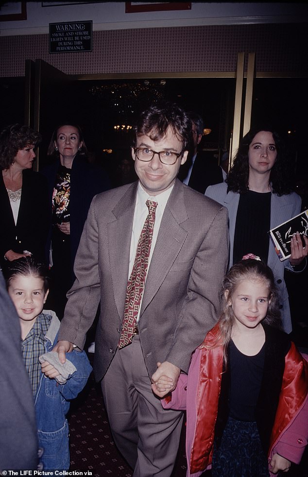 The couple had two children together: Rachel and Mitchell, as Moranis is seen with his children in 1989