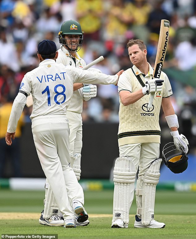 Kohli touched another Australian star on Friday, but this time he congratulated Steve Smith (right) on his century as Pat Cummins looked on