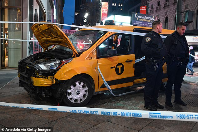 The taxi driver was taken to hospital in a stable condition for further checks and police have not yet made any arrests (crash scene photo)