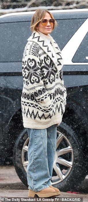 She also wore a white knit turtleneck, wide-leg jeans and Timberland-style boots